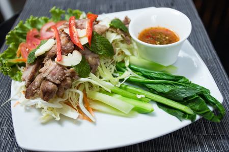 Grilled pork with spicy seafood sauceの写真素材