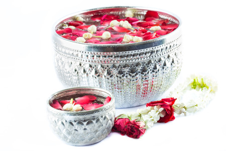 Thai garland Flowers and Water with jasmine and roses corolla in bowl isolated on white background (Use for Songkran festival in Thailand)の写真素材