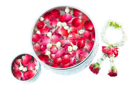 Thai garland Flowers and Water with jasmine and roses corolla in bowl isolated on white background (Use for Songkran festival in Thailand)の写真素材