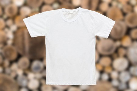 White blank T-shirt on wood texture backgroundの写真素材