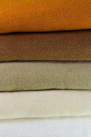 Background texture of Pile of colorful clean towelsの写真素材