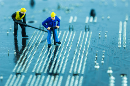 Team of engineers repairing circuit mother board. Computer repair conceptの写真素材