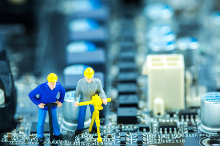 Team of engineers repairing circuit mother board. Computer repair conceptの写真素材