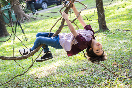 Little boy climb on a tree ropeの写真素材