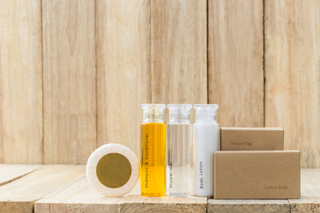Tubes of bathroom amenity contains on wooden backgroundの写真素材