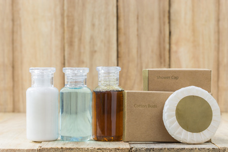 Tubes of bathroom amenity contains on wooden backgroundの写真素材