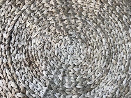 full frame of woven water hyacinth round table in natural light brown color, using for background