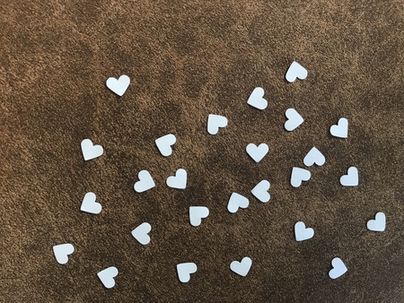 heart shape white papers on brown fabric, using for background, "valentine's dayâ conceptの写真素材