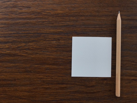 natural brown wood pencil and white blank paper putting on dark brown wood table with copy space on left side, âgetting ideaâ conceptの写真素材