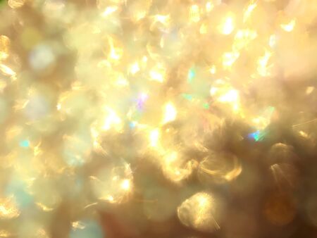 blurred close-up golden glitter ball in full-frame, fantive and celebration conceptの写真素材