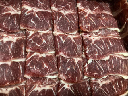 beautiful fresh raw sliced chuck eye beef meat with natural red color and white fatの写真素材