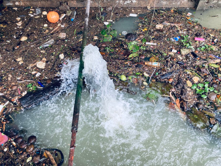 the river which is full of garbage that people dump into it, making the pollution of our environmentの写真素材
