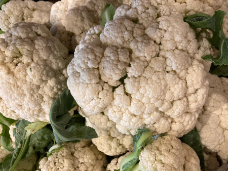 white cauliflower vegetable at the indoor fresh market in full frame shot, using as backgroundの写真素材