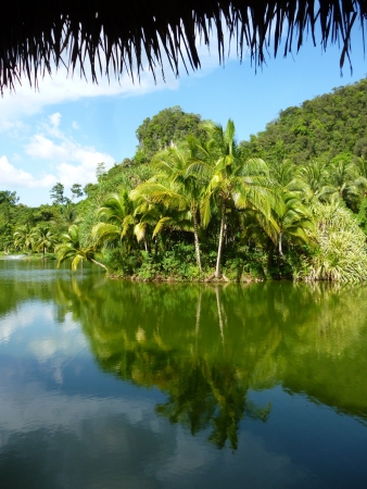 Reflection of cloudy in pond in Malitime resort, Krabi province, Thailandの写真素材