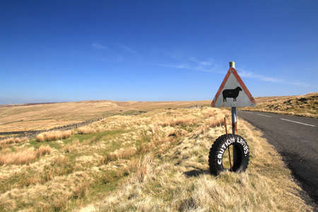 A road sign on a hillsideの写真素材