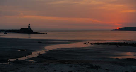 Sunset at the lighthouse in Saint Malo, Brittany, Franceの写真素材