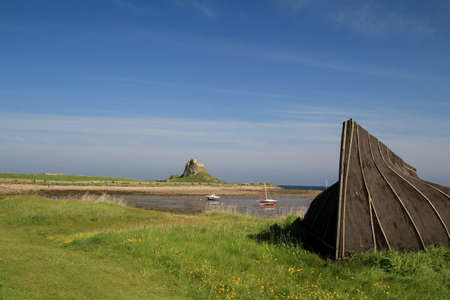 A view of the ruins of a medieval castle on the north coastの写真素材