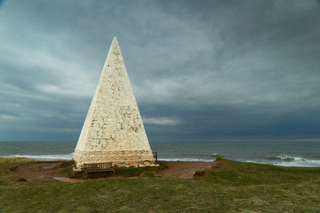 Old lighthouse on the coast of the Baltic Sea in Liepaja, Latviaの写真素材