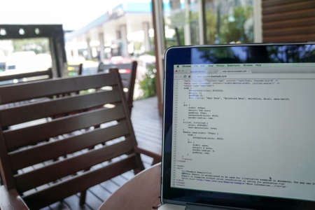 Screen of program coding on laptop at coffee shopのeditorial素材