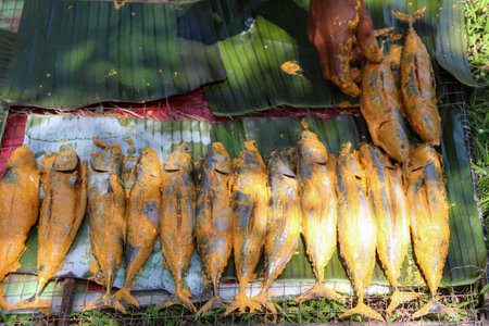 Fried mackerel on banana leaf in the market, Thailand.の写真素材