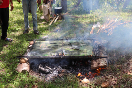 Cooking on the fire in the forest, traditional food for touristsの写真素材
