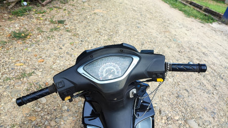Close up view of the headlight of a modern scooter.の写真素材