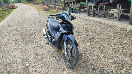 Motorcycle parked on the road in the countryside of indonesiaの写真素材