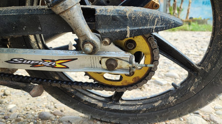 Rear wheel of a motorcycle with a chain, close-upの写真素材