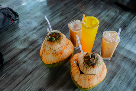 Coconut smoothies with fresh coconut on wood table, stock photoの写真素材