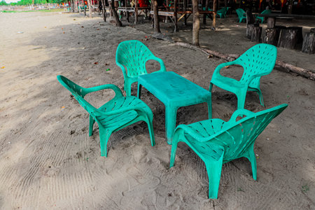 Green chairs on the beach in the evening, Chonburi, Thailandの写真素材