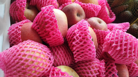 Fruits in a basket on a market stall, closeup of photoの写真素材