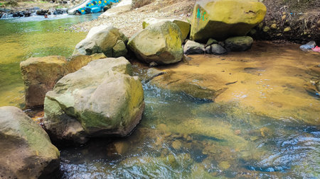 Water flowing between stones in the forest, Thailand. Nature background.の写真素材