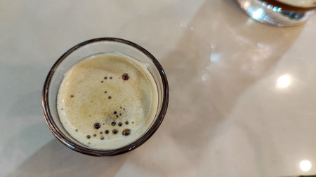 Coffee in a glass on the table, top view.の写真素材