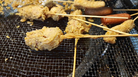 Fried pork satay on the grill, street foodの写真素材