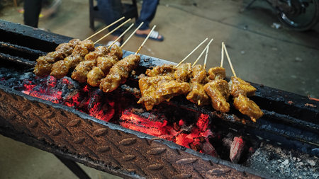 Thai street food grilled chicken on the grill in Bangkok, Thailandの写真素材