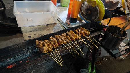 Grilled chicken satay at street food market in Bangkok, Thailandの写真素材