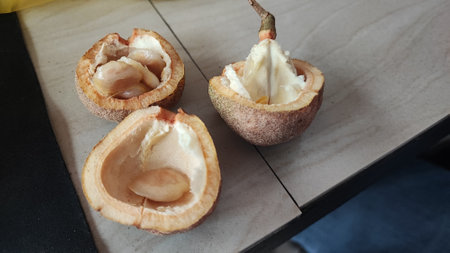 Mangosteen on a wooden table in the kitchenの写真素材