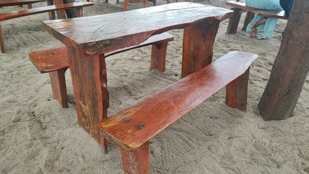 Wooden table and chairs on the beach in Thailand, Asia.