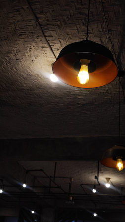 Vintage lamp hanging on the ceiling in a cafe, stock photoの写真素材
