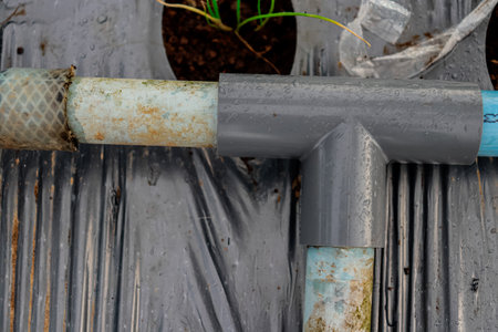 Plastic drainage pipes on the roof of a house, close up