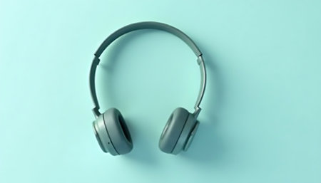 Stylish Gray Headphones on a Mint Green Background Minimalist Tech Product Shotの素材
