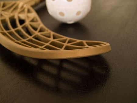 Floorball stick and ballの写真素材