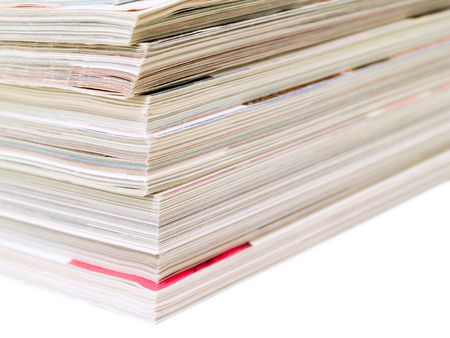Stack of magazines isolated on a white backgroundの写真素材