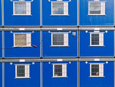 Blue barracks on a construction siteの写真素材