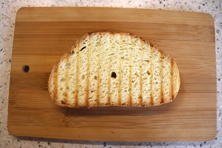 toasted bread on a wooden board