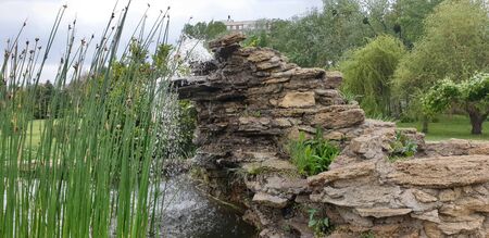 small waterfall in the parks on the rocksの写真素材