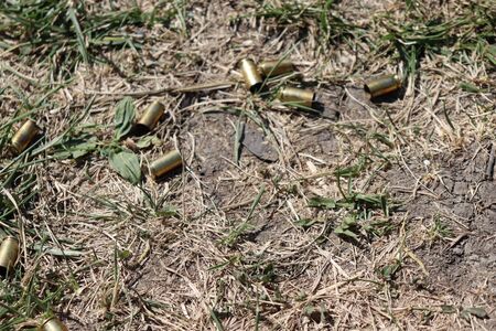 shells on the ground, shot cartridges