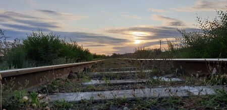 railway tracks go to sunsetの写真素材