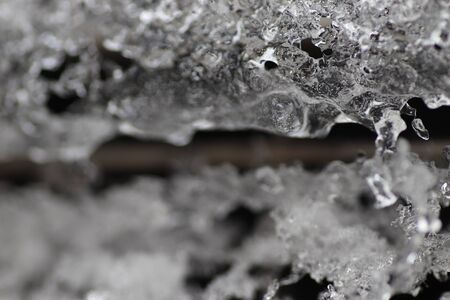 winter, ice and snow on a metal grill auto, macroの写真素材