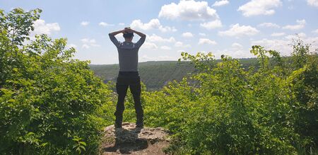 bangs on a hill, green slope and blue skyの写真素材